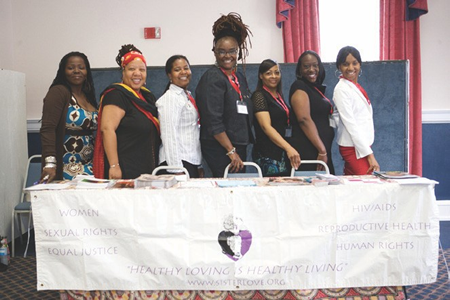Group from Sistalove at a conference table